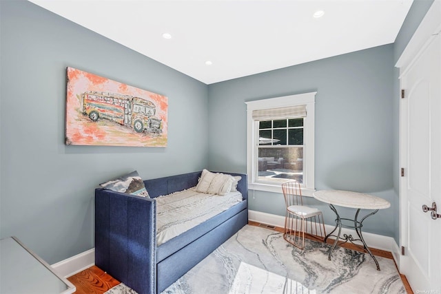 sitting room with wood-type flooring