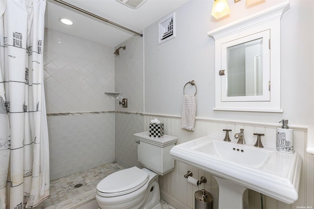 bathroom with toilet and walk in shower