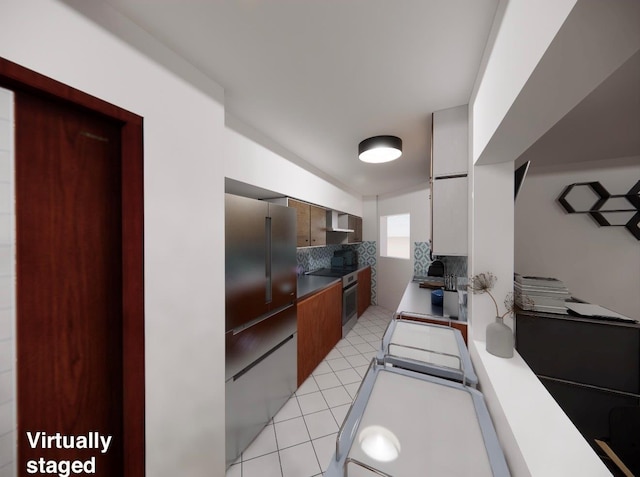 kitchen featuring light tile patterned floors, stainless steel appliances, sink, and backsplash