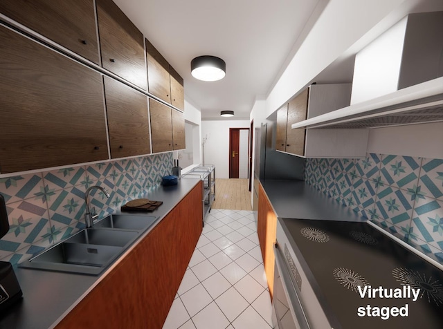 kitchen with light tile patterned floors, backsplash, sink, and wall chimney exhaust hood