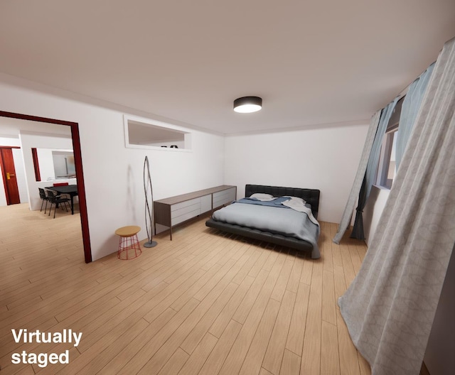 bedroom with light hardwood / wood-style flooring