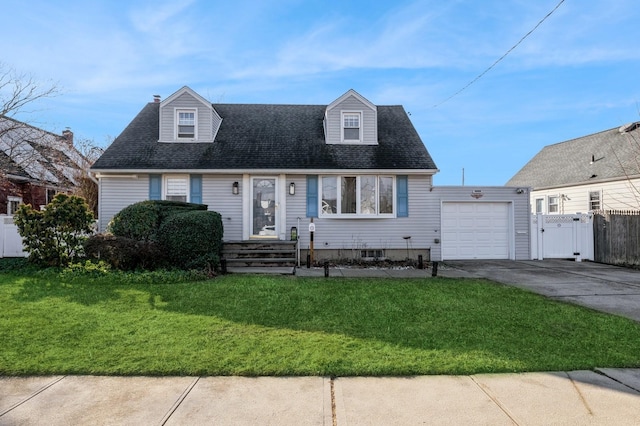 cape cod-style house featuring a garage and a front yard