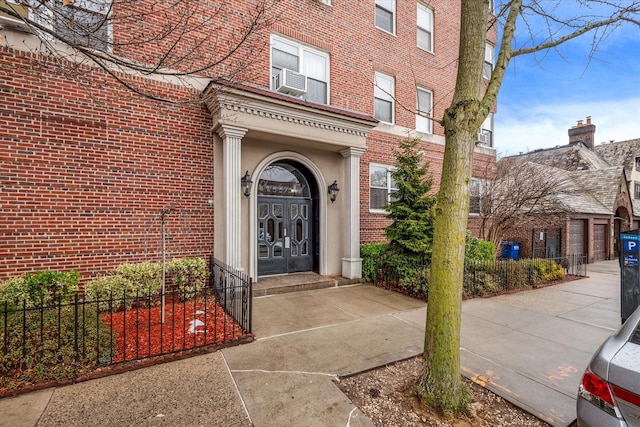 entrance to property with cooling unit and french doors