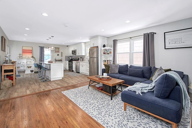 living room featuring plenty of natural light and light wood-type flooring