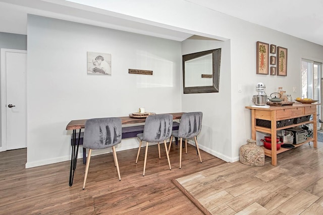 dining space featuring hardwood / wood-style flooring