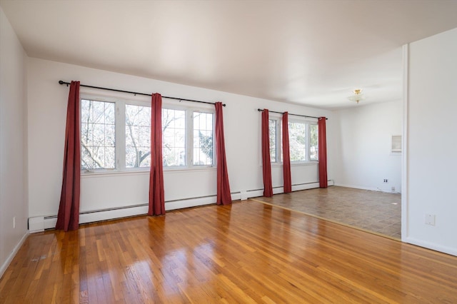 unfurnished room with hardwood / wood-style floors