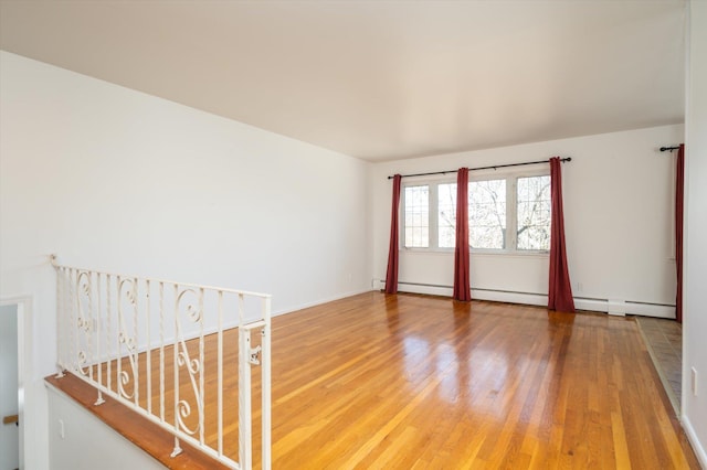 empty room with wood-type flooring