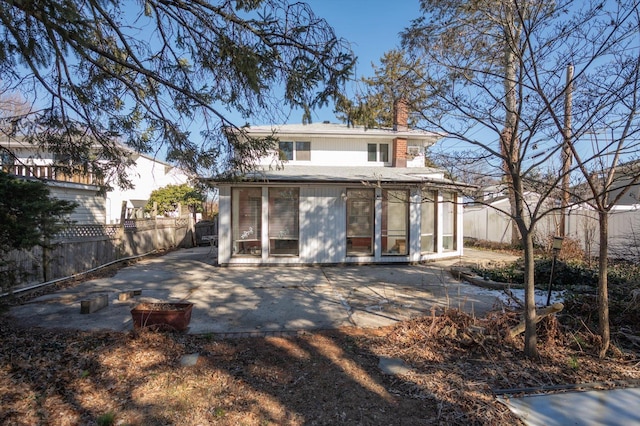 back of house with a patio