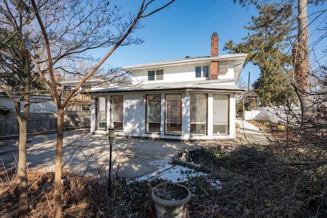 rear view of house with a patio