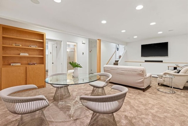 carpeted living room featuring a baseboard radiator