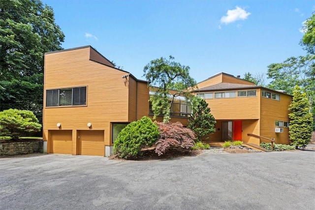 view of side of property featuring a garage