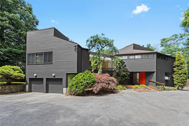 view of side of home featuring a garage