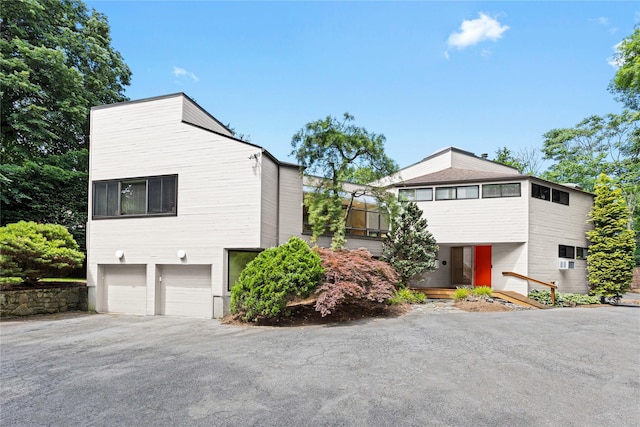 view of side of property with a garage