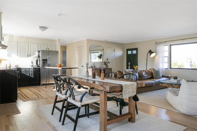 dining space with light hardwood / wood-style floors