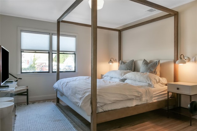 bedroom with wood-type flooring