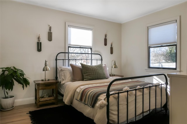 bedroom with wood-type flooring