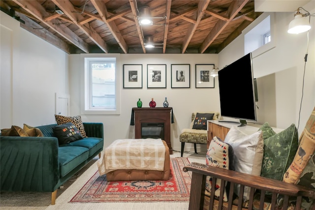 living room featuring beamed ceiling and wood ceiling