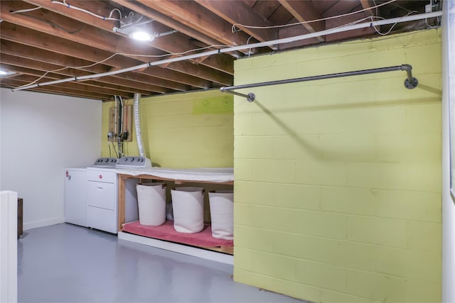 basement featuring washing machine and clothes dryer