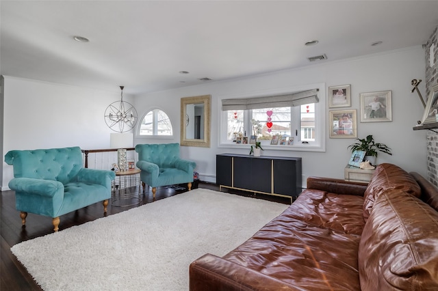 living room featuring crown molding, plenty of natural light, a baseboard radiator, and wood-type flooring