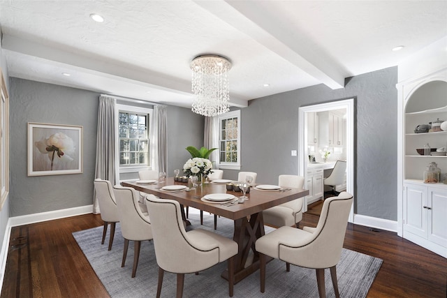 dining space with dark wood-type flooring, beamed ceiling, and an inviting chandelier