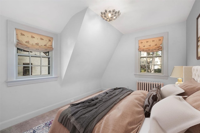 bedroom featuring carpet and radiator heating unit