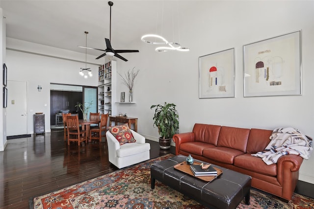 living room featuring ceiling fan and hardwood / wood-style floors