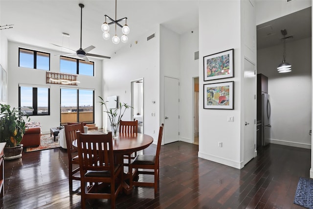 dining area with dark hardwood / wood-style floors and ceiling fan