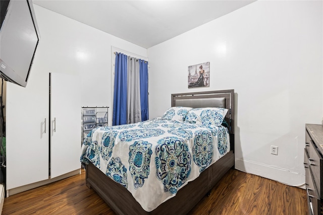 bedroom featuring dark hardwood / wood-style floors