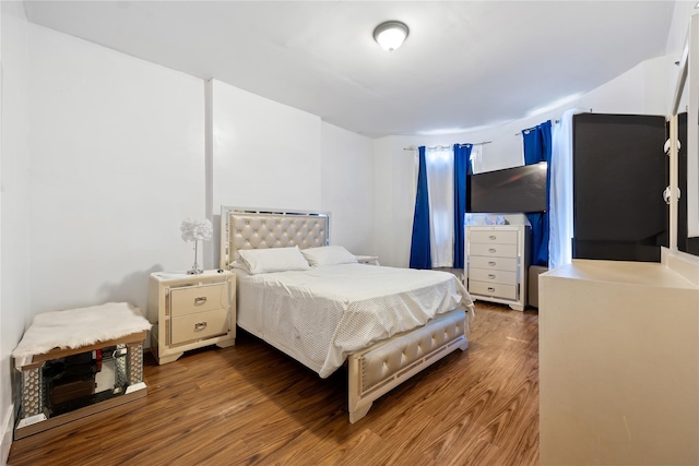 bedroom featuring wood-type flooring