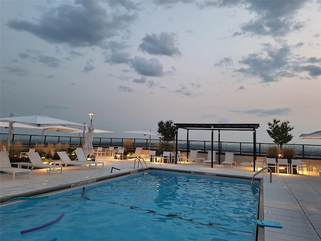 view of swimming pool featuring a patio area