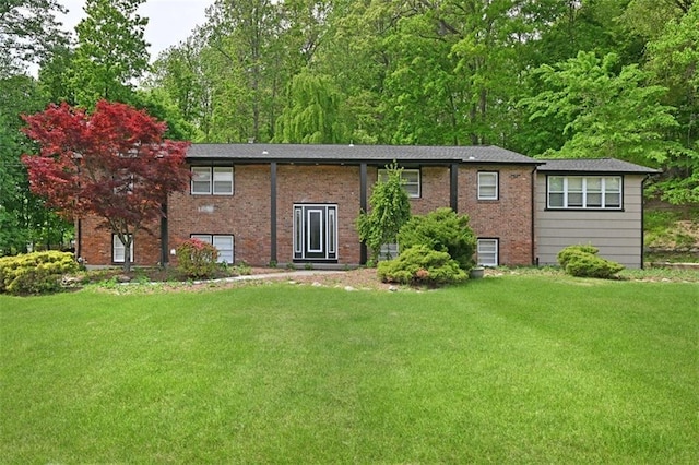 rear view of house with a yard