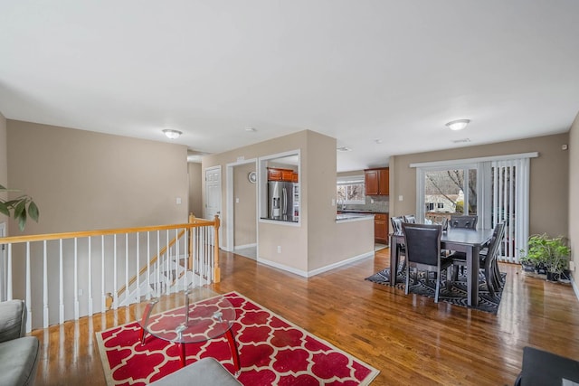 dining room with wood-type flooring