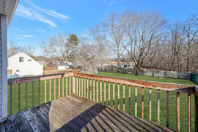 wooden terrace with a lawn