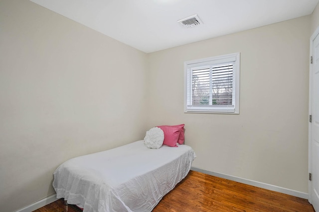 bedroom featuring dark hardwood / wood-style flooring