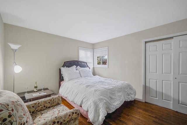 bedroom with dark wood-type flooring