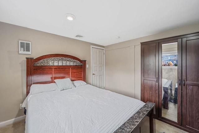 carpeted bedroom featuring a closet