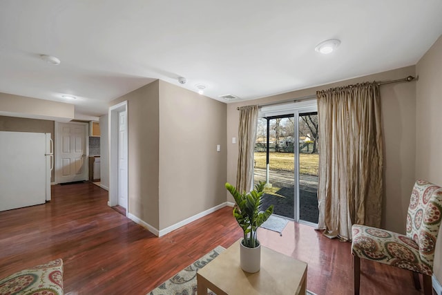 sitting room with dark hardwood / wood-style floors