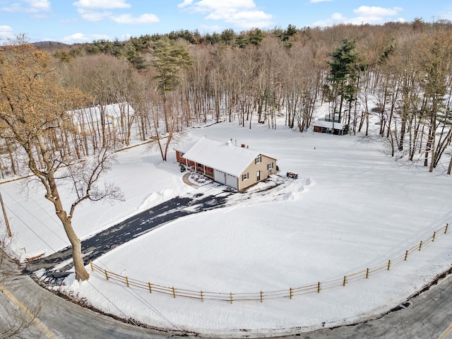 snowy aerial view featuring a rural view