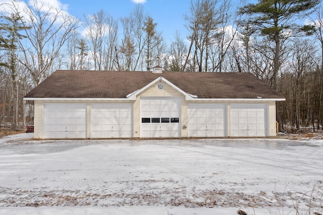 view of snow covered garage