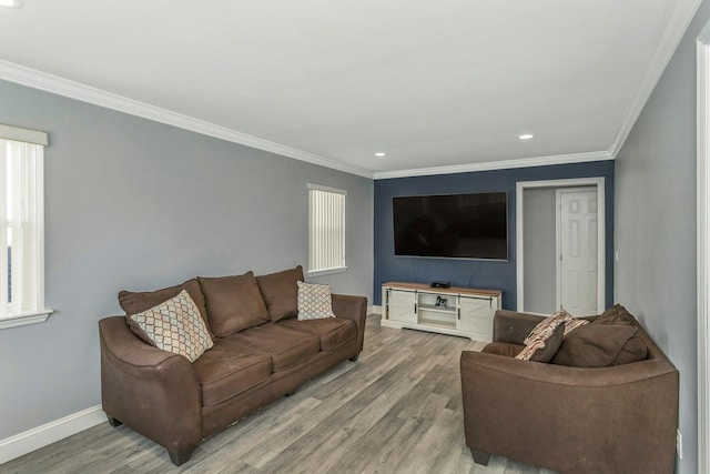 living room with crown molding and hardwood / wood-style floors