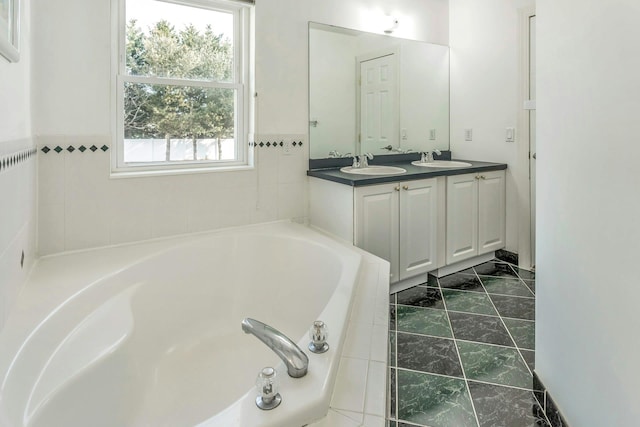 bathroom with vanity and a bathtub