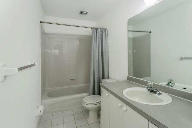 full bathroom with vanity, toilet, tile patterned floors, and shower / bath combo with shower curtain