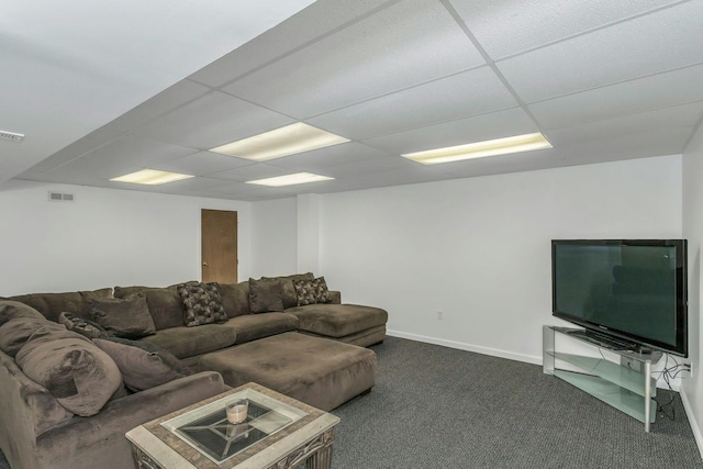 living room with a paneled ceiling and carpet flooring