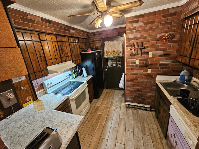 kitchen featuring brick wall, wood finish floors, a sink, ornamental molding, and white electric range oven