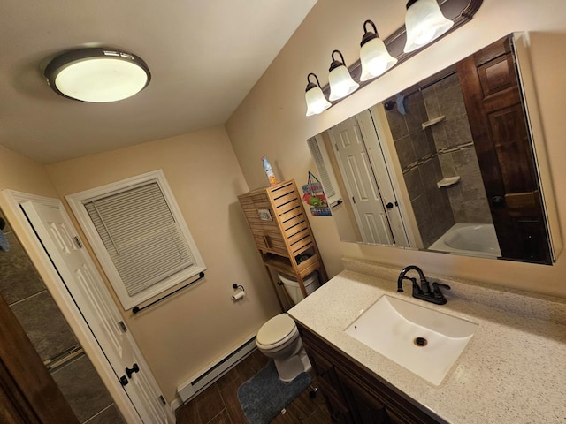 full bathroom featuring toilet, wood finished floors,  shower combination, vanity, and a baseboard heating unit