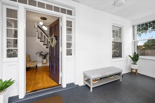 entrance to property with covered porch and ceiling fan