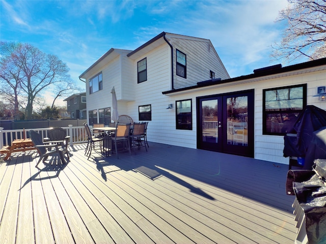 wooden deck featuring french doors