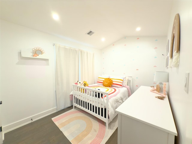 bedroom featuring vaulted ceiling and dark wood-type flooring