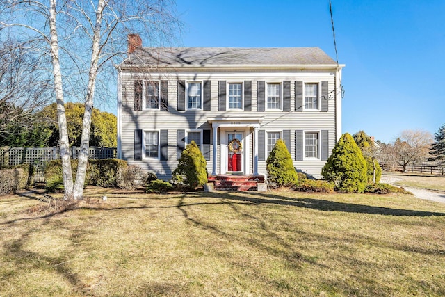 colonial home with a front yard