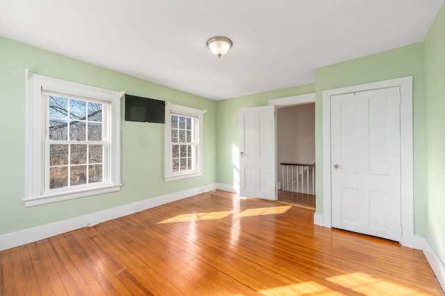 unfurnished bedroom with wood-type flooring